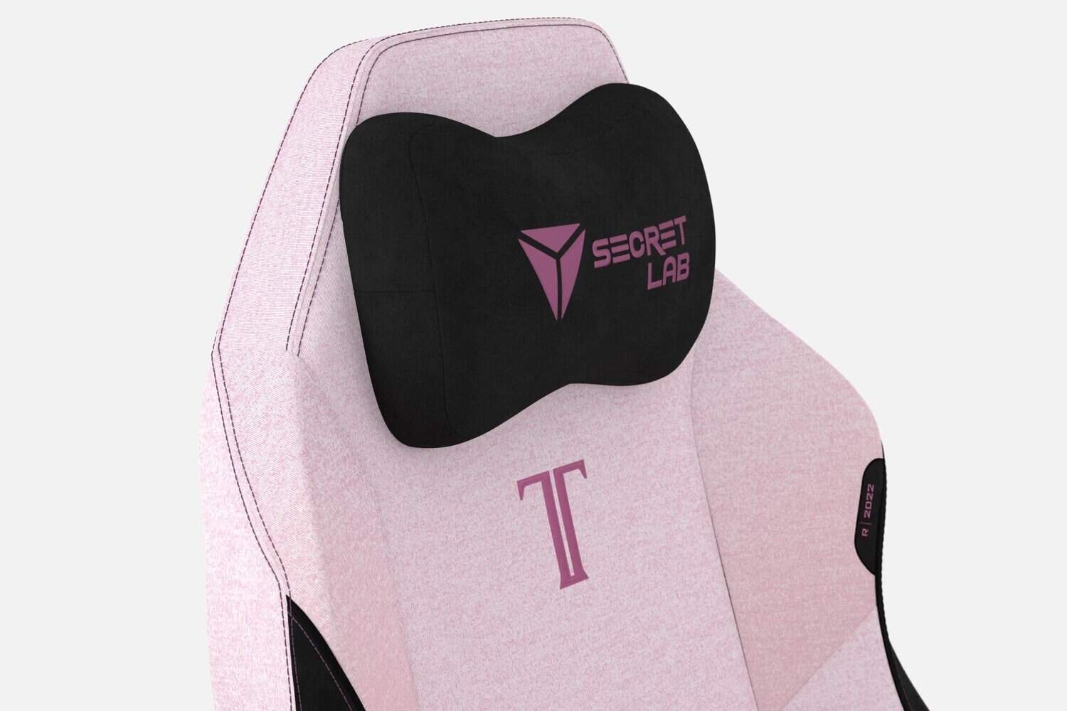 Siège gamer Secret Lab rose avec coussin tête.